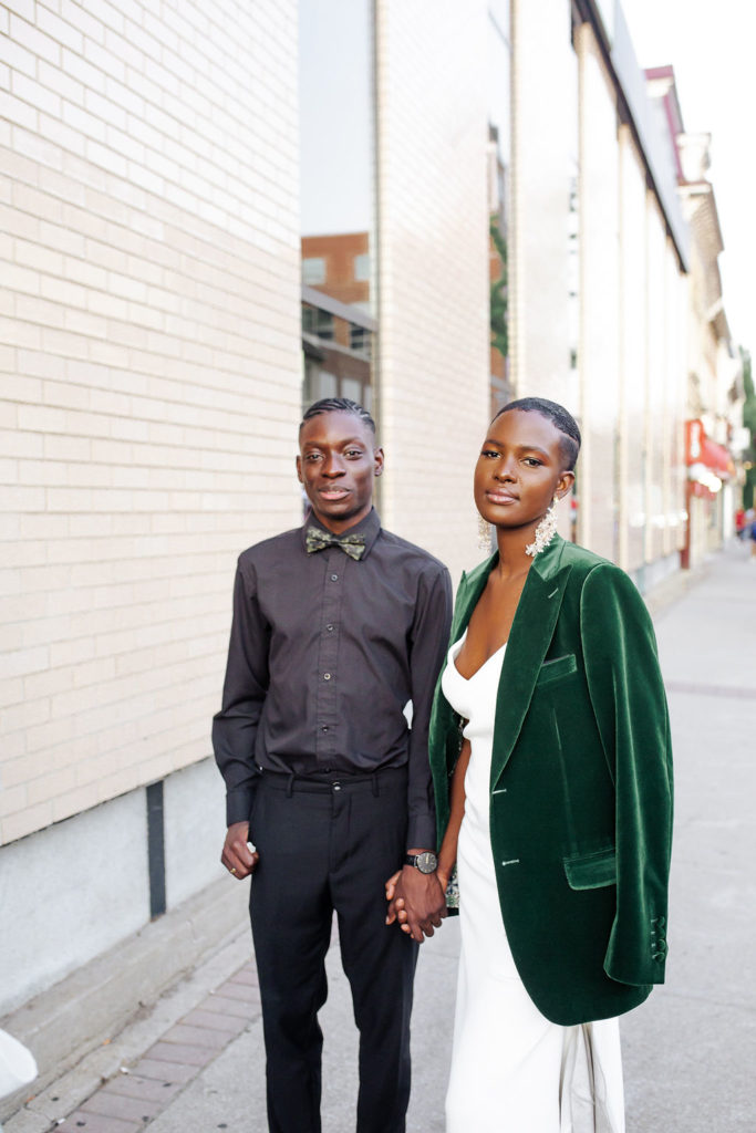 Couple wearing green velvet suit jacket in city streets| Weddings & Events by Cheryl Munro | Toronto Wedding Planner