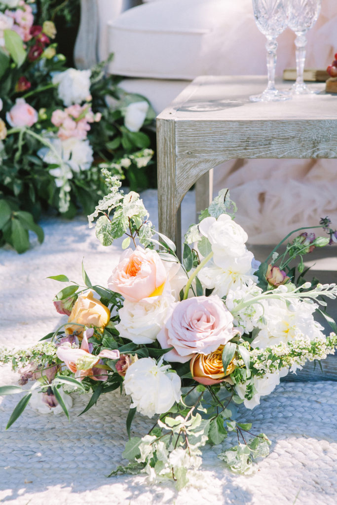Floral arrangement of blush, white and orange flowers  | Weddings & Events by Cheryl Munro | Toronto Wedding Planner