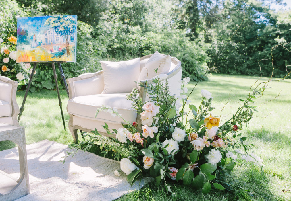 Lounge furniture with floral arrangement and artwork  | Weddings & Events by Cheryl Munro | Toronto Wedding Planner