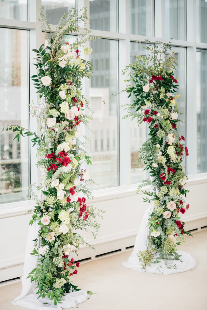 Floral arch that has white, cream and burgundy flowers | Weddings & Events by Cheryl Munro | Toronto Wedding Planner