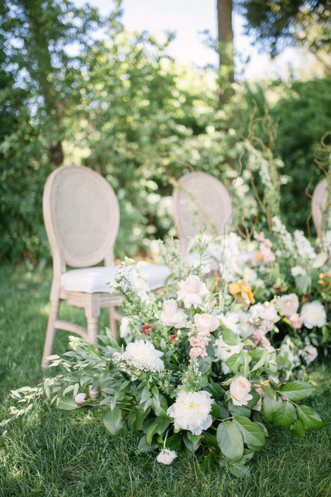 Ceremony chairs with flowers  | Weddings & Events by Cheryl Munro | Toronto Wedding Planner