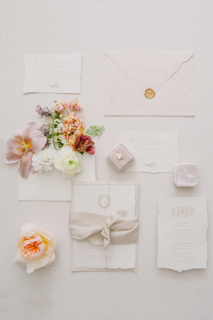 Stationery flatlay with flowers and wedding invites  | Weddings & Events by Cheryl Munro | Toronto Wedding Planner