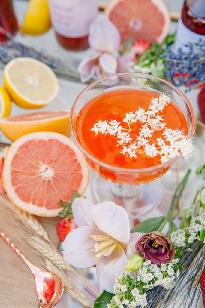 Orange cocktail with fruit and flowers  | Weddings & Events by Cheryl Munro | Toronto Wedding Planner