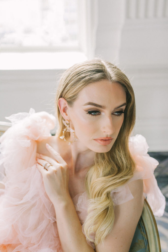 Bride in pink ruffle dress looking away with hand on shoulder | Weddings & Events by Cheryl Munro | Toronto Wedding Planner