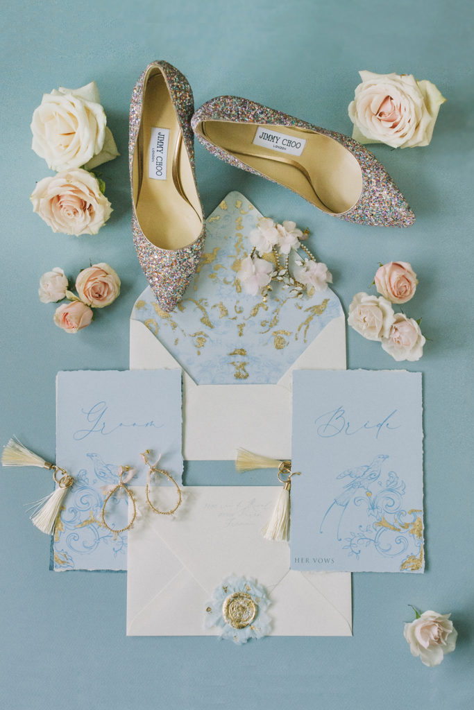 Detail shot of Jimmy Choo shoes, flowers and vow books  | Weddings & Events by Cheryl Munro | Toronto Wedding Planner