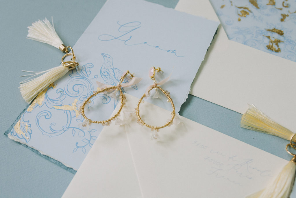 Delicate earrings with wedding stationery  | Weddings & Events by Cheryl Munro | Toronto Wedding Planner